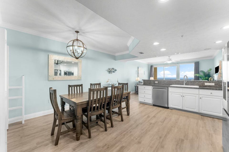 Gather around the dining table with your loved ones and enjoy ocean views while preparing meals in the fully equipped kitchen—all in a bright, open space with soothing coastal colors.