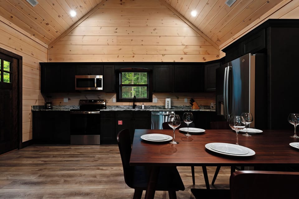 The fully equipped kitchen makes group meals easy, with granite countertops, stainless appliances, and dining space for the whole crew.