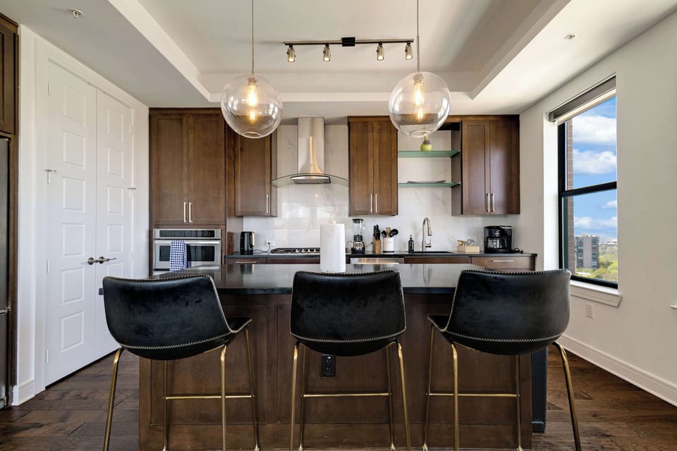 Large kitchen island with bar seating for gathering and dining