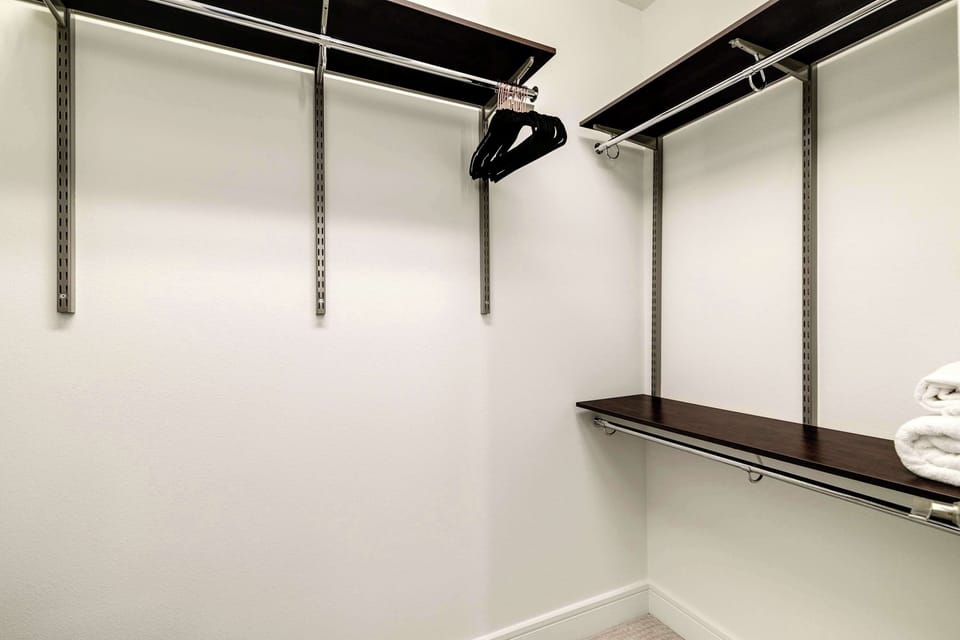 Oversized walk-in closet with built-in shelving