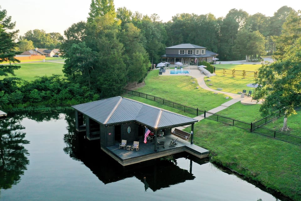Private waterfront retreat with dock, pool, and sprawling grounds