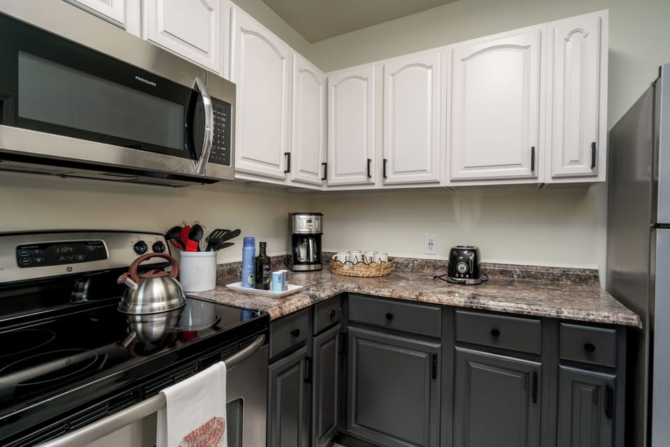 Stylish two-tone kitchen with full appliances and ample counter space