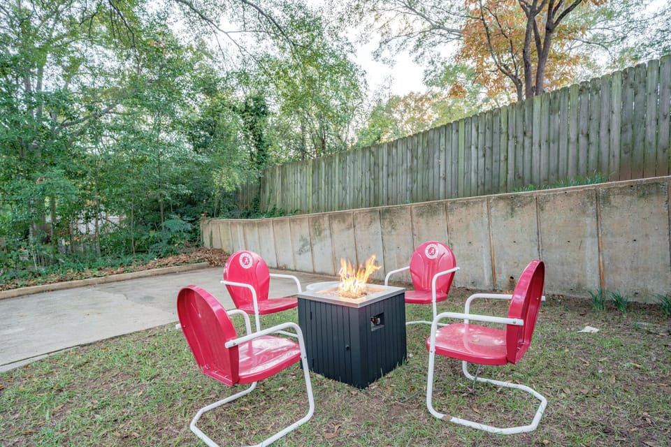 Cozy backyard fire pit with private seating under the trees