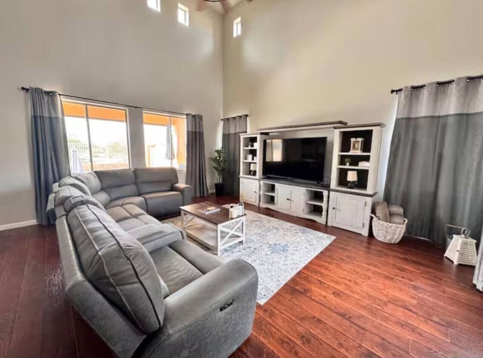 Spacious and cozy living room with a Smart TV and entertainment center