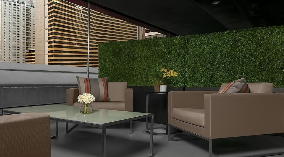 Sip cocktails outdoors in a sleek terrace lounge above the city.