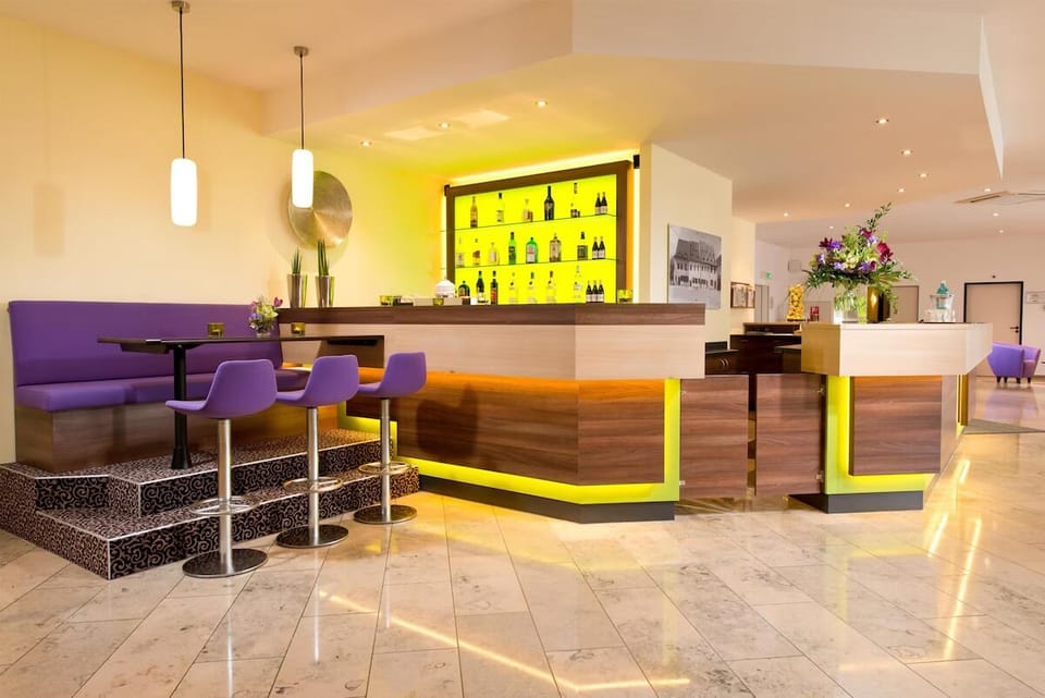 Unwind with a nightcap at the glowing, contemporary bar.