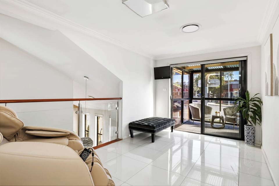 Wellness Space with Massage Chair, Assault Bike and Yoga Equipment