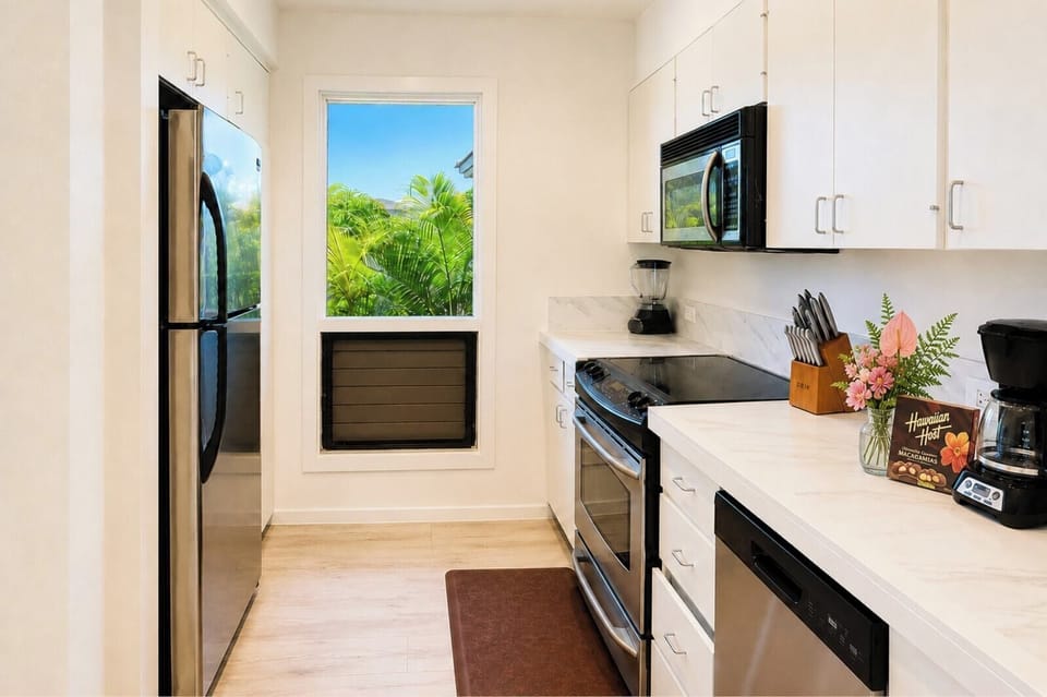 Galley kitchen fully equipped for home-cooked island meals