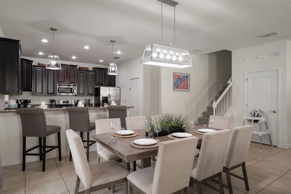 Full kitchen will all cooking and dining essentials. Open floor plan provide tons of space for everyone to be together. 8 top dining table, bar seating and huge sectional couch!