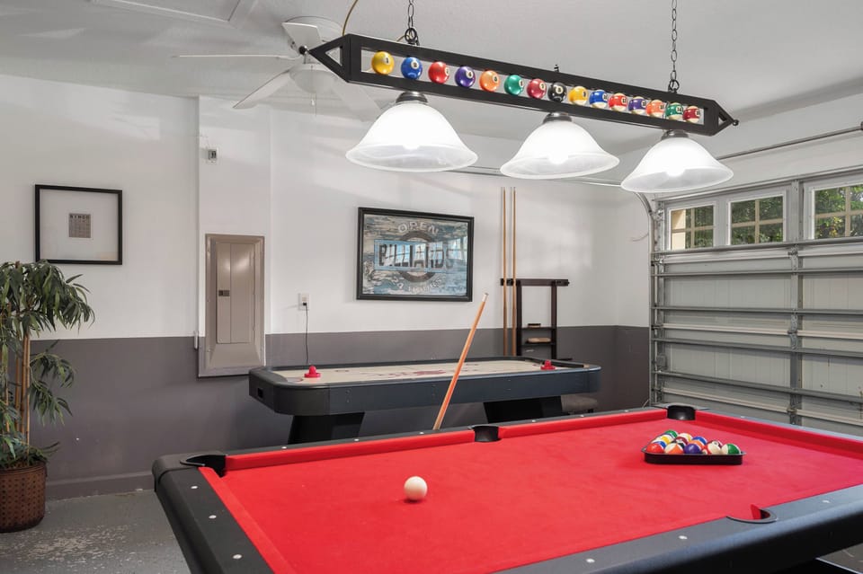 Game room in garage featuring air hockey & ping pong
