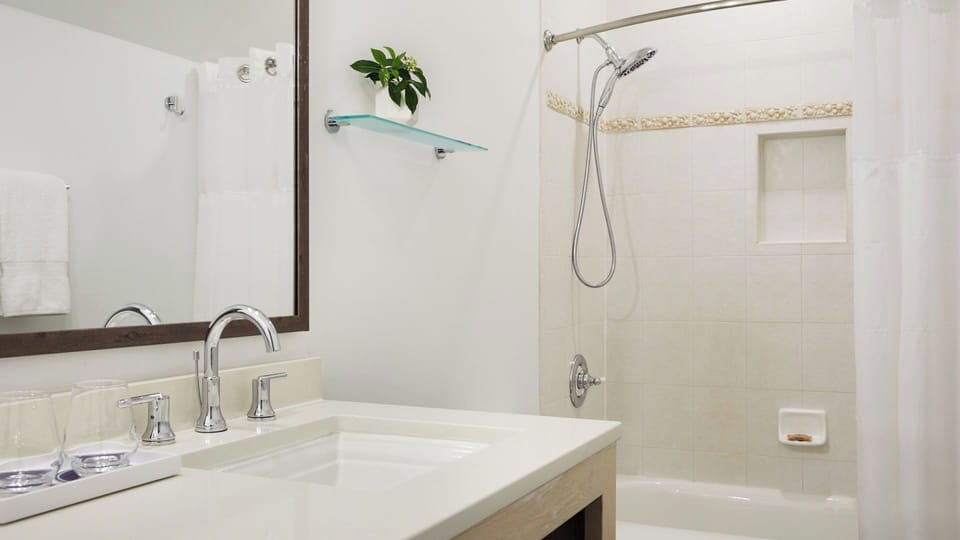Relax with a soothing shower and crisp, spa-like bathroom finishes.