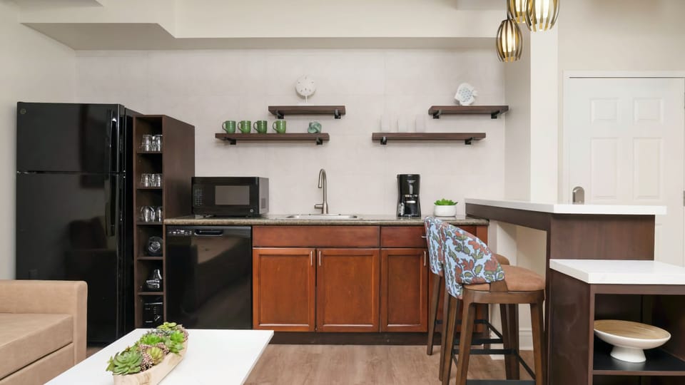 Kitchenette with full-size fridge and stove