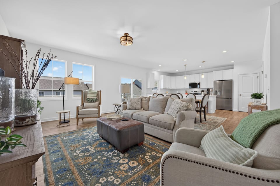Relax in a bright, inviting living room styled with comfortable seating.