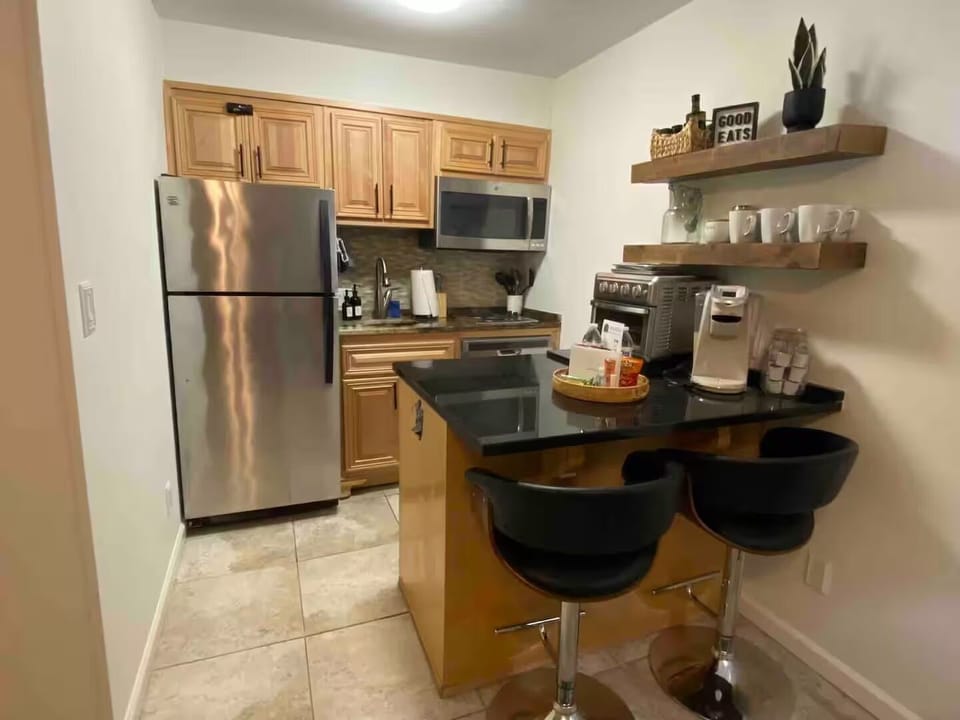 Kitchen includes eating area for two.
