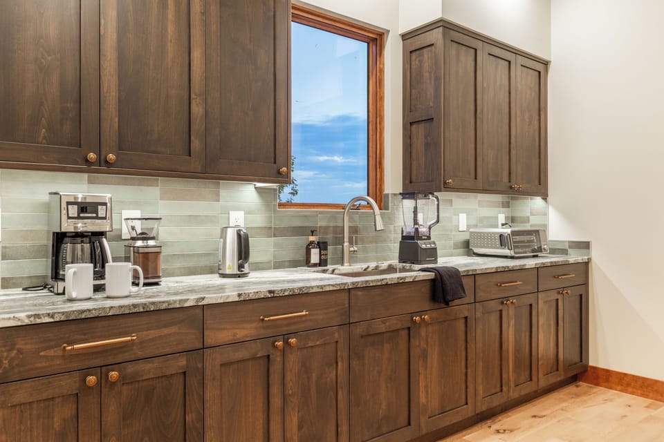Butler's Pantry off the main kitchen allows for extra prep space and coffee area.