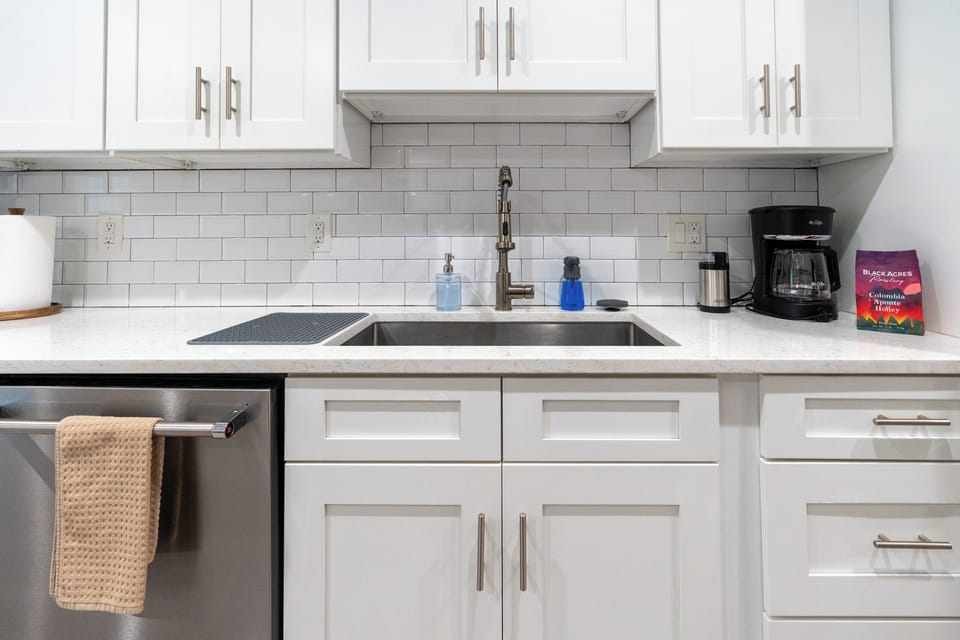 Subway-tile kitchen, fully stocked for cooking in