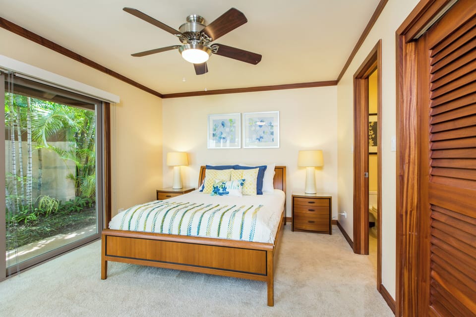 The downstairs suite opens to garden green, an easy retreat from the busy floors above.
