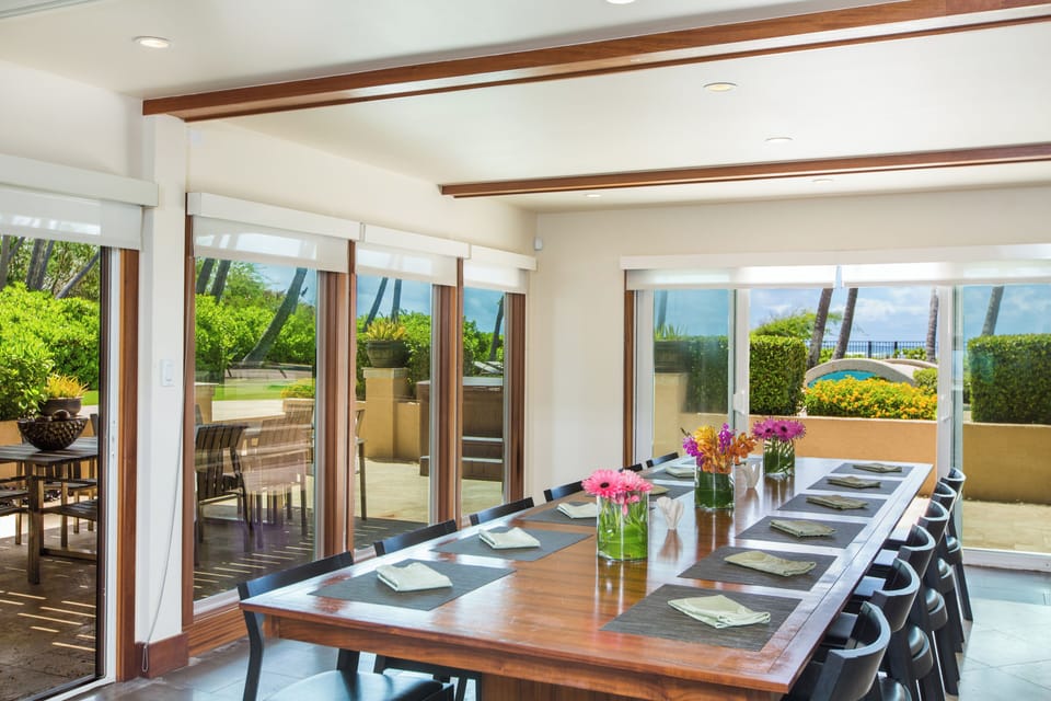 Dinner for the whole group, with sliding glass walls pulling the ocean to the table.