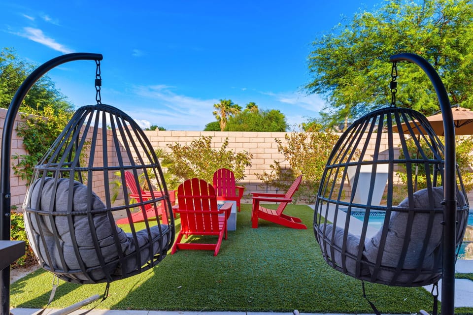 Relax in cozy hanging chairs under the shade