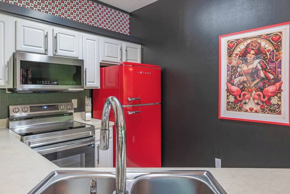 This cozy and colorful kitchen is ideal for preparing meals, bonding, and enjoying great conversations with family and friends.