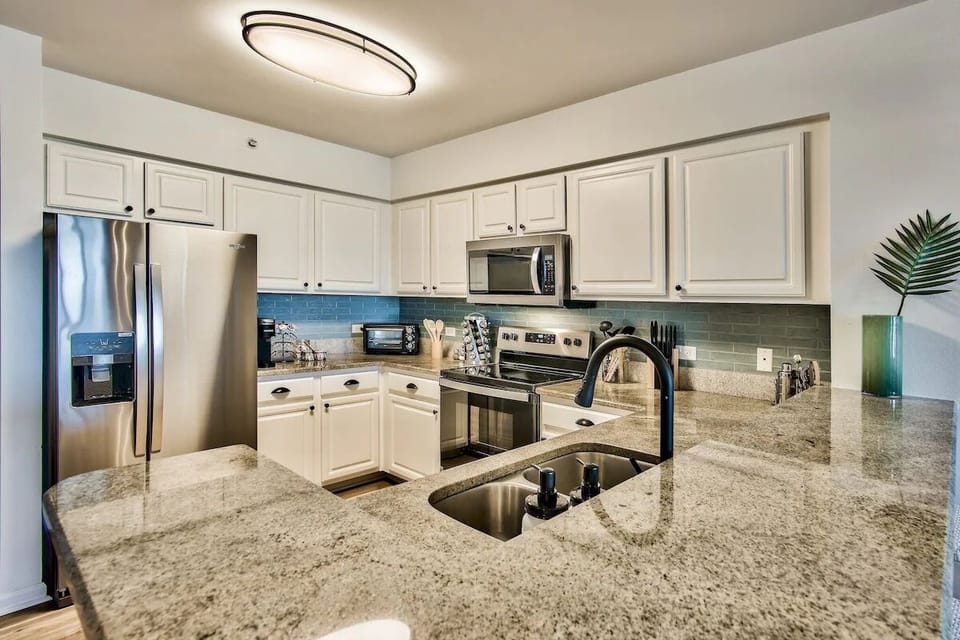 Private Kitchen with large counter tops and stainless steel appliances