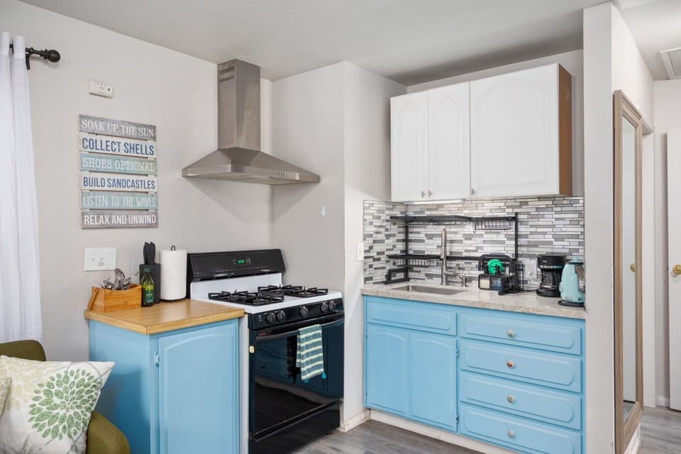 Fully equipped kitchen with a gas range, oven, and everything you need for meals at home.