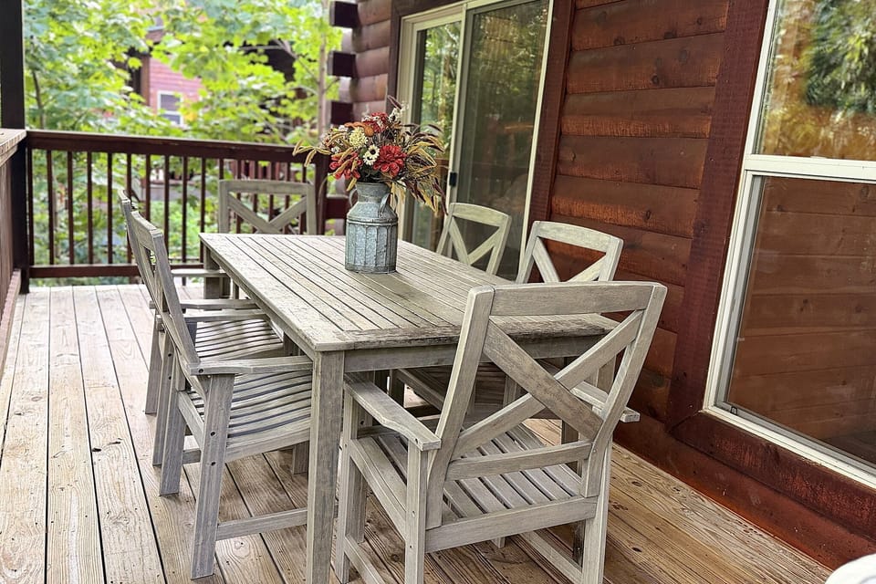 Private covered deck with rustic outdoor dining for six