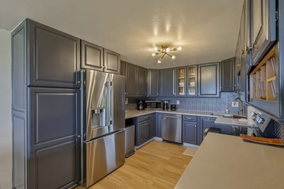 Modern kitchen with island seating and stainless appliances