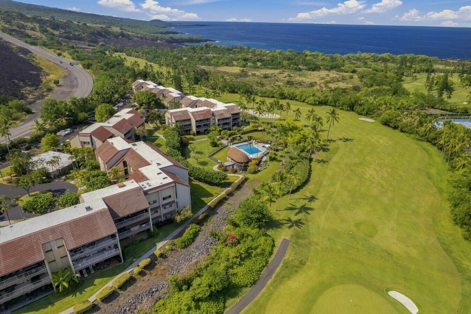 Wide aerial view of the community and Kona Country Club