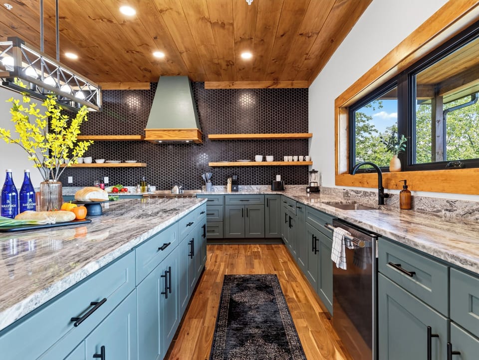 Fully equipped kitchen detailing the extensive cabinetry space and stainless steel appliances.