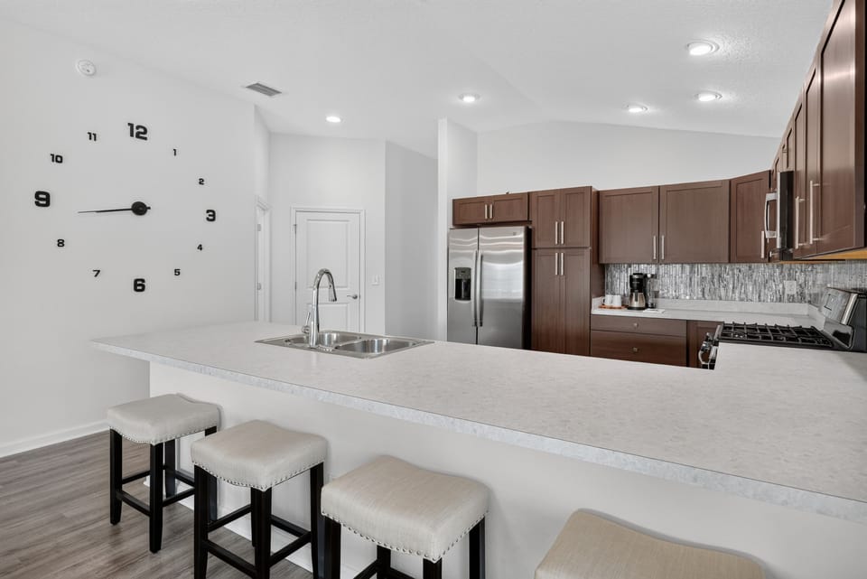 Plenty of Counter Space in This Fully Equipped Kitchen. Straight Back is the Door to the Garage. To the Left of the Garage Door is the Guest Bedroom