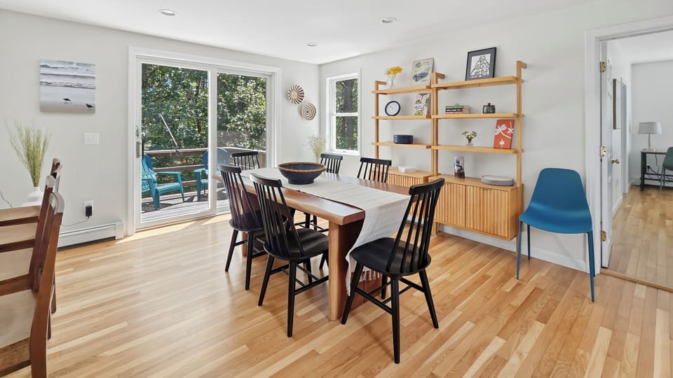 Dining area with slider to small upper deck