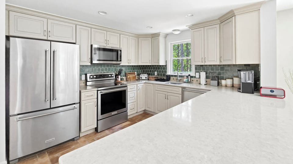 Nicely equipped kitchen with stainless appliances