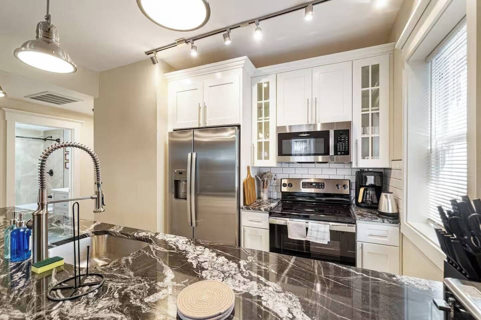 Bright, modern, and inviting, this open living area is designed for comfort, connection, and memorable stays.