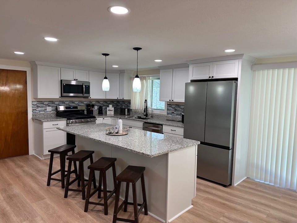 A fully stocked kitchen makes it easy to cook breakfast before the lake or enjoy dinner together after a day of exploring.