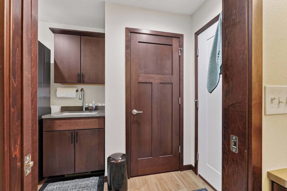 Back hall Mudroom features laundry and half bathroom
