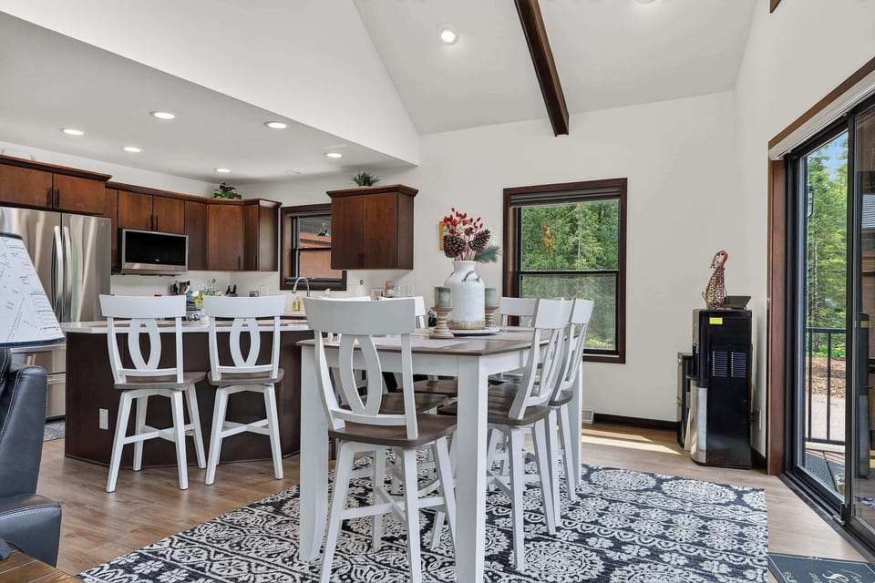 Bar top seating for 6 at the main table. 3 breakfast bar seats