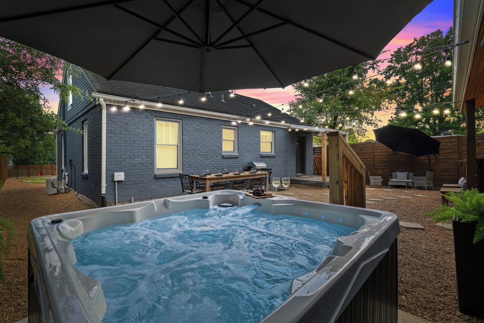 Private back yard hot tub, patio dining and lounge.