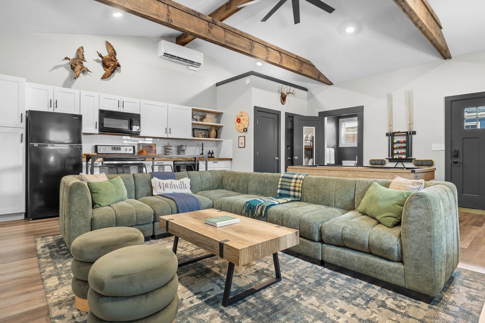 Clubhouse rec room with full kitchen, full bathroom, pool table, bunk beds, arcade games and 75" tv.