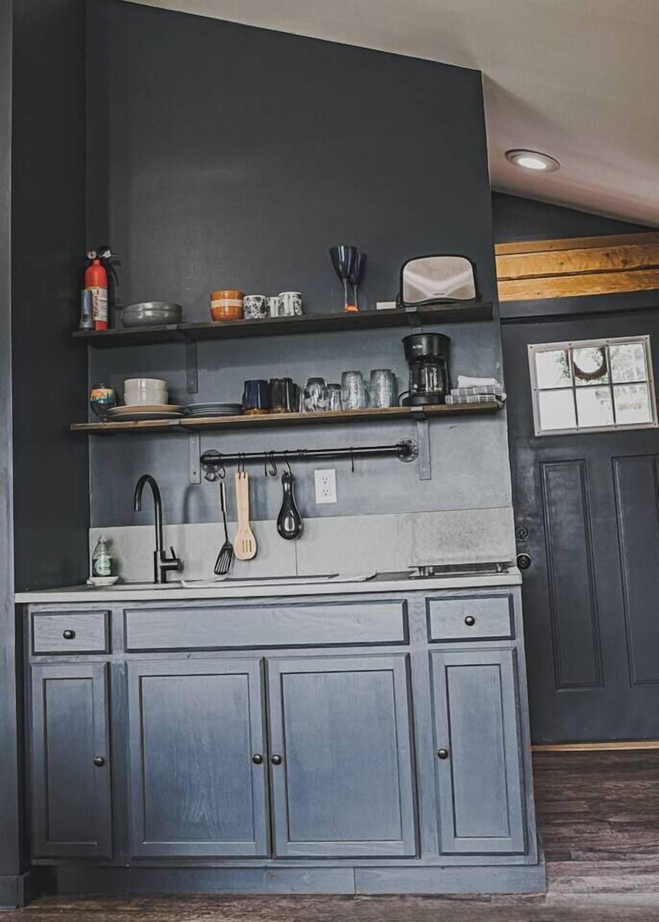 Your kitchenette has a coffee pot and filters, toaster, two burner cooktop, sink, mini fridge with small freezer and a microwave. 