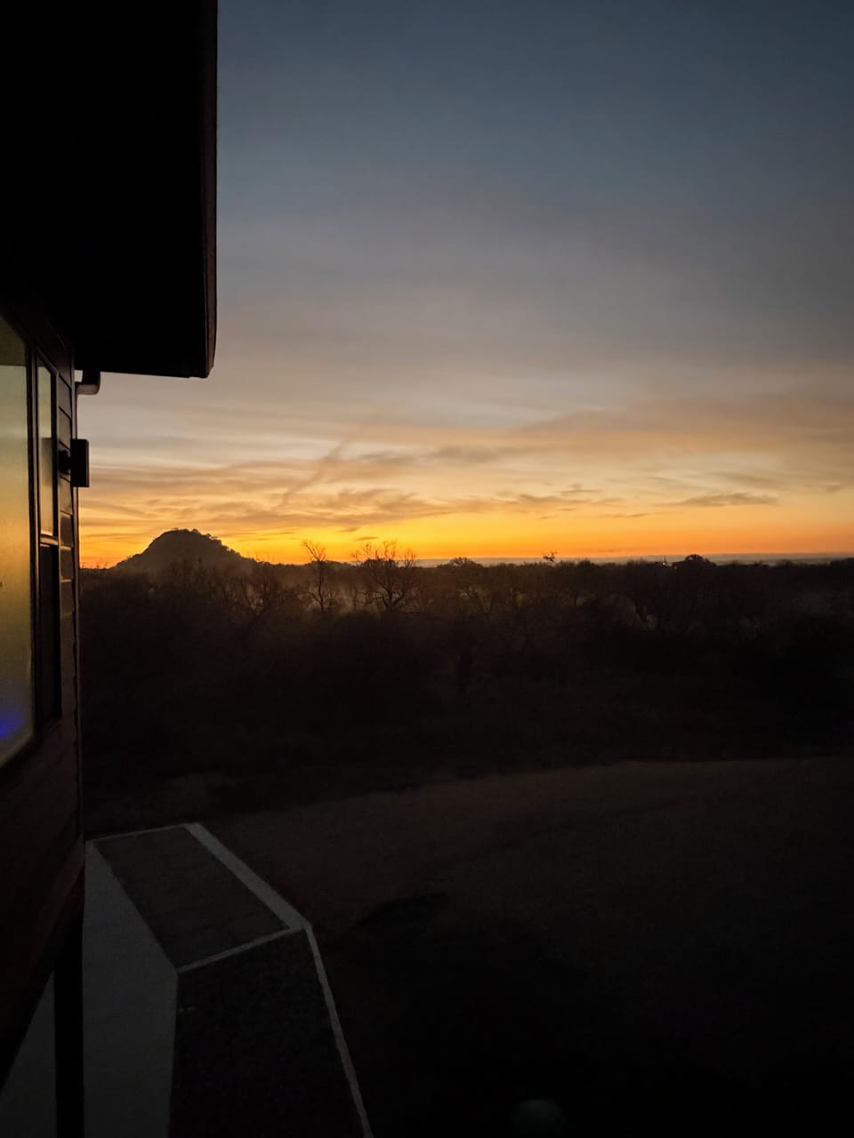 Winter sunsets behind Bill Pickett Hill.