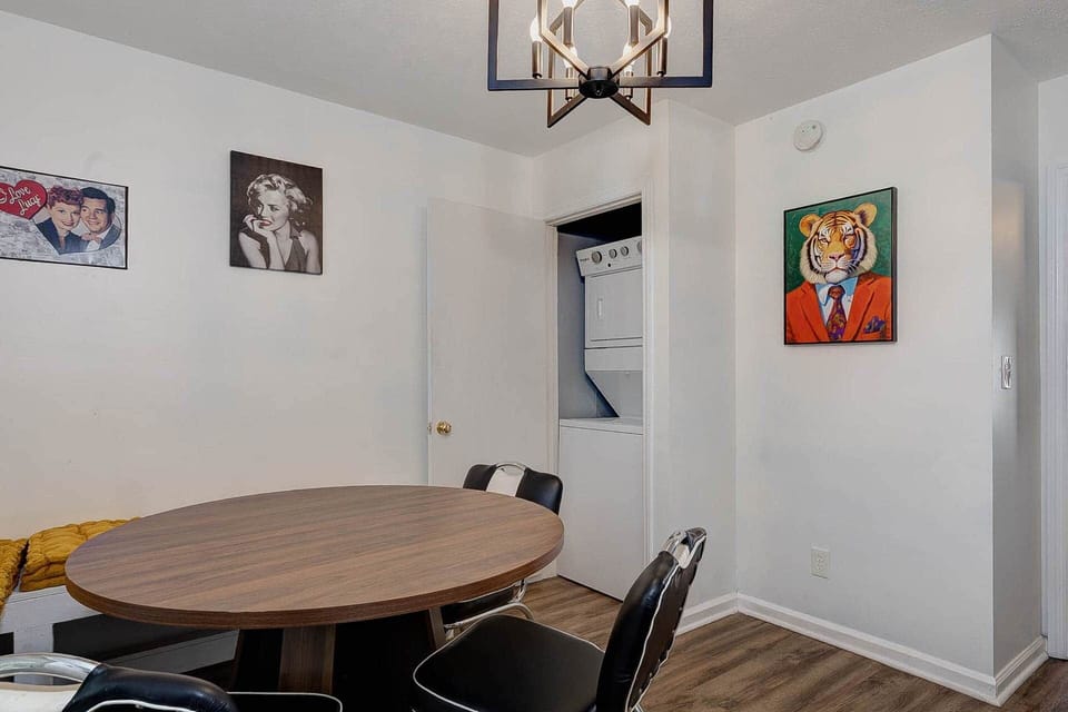 In-unit washer and dryer tucked off the dining room — pack light for your Fort Benning graduation we