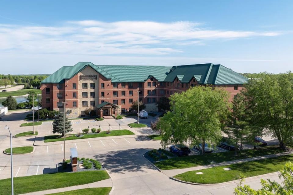Aerial view of building with green roof.