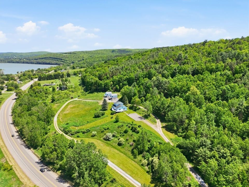 Aerial View | Wooded Setting & Lake Views | Circular Driveway & Two-Structure Property