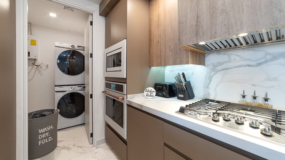 Kitchen detail and washer dryer.