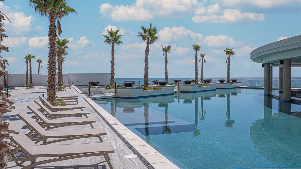 Chaise lounge chairs and aqua bar.