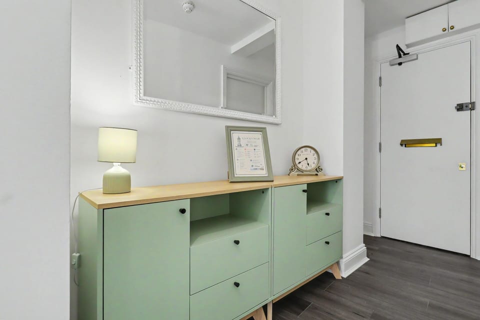 Bright, stylish entryway with mirror and practical storage console