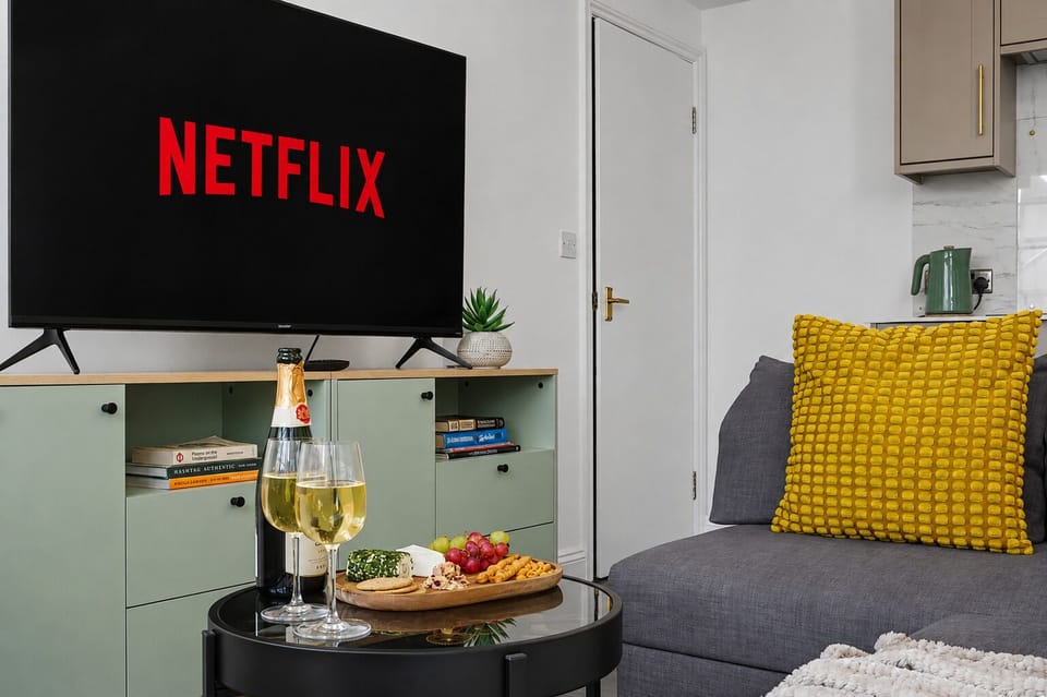 Cozy lounge with Netflix, plush seating, and wine-ready evenings