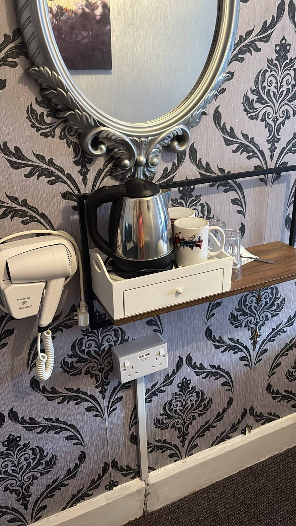 Stylish tea station with kettle, mirror, and boutique décor touches