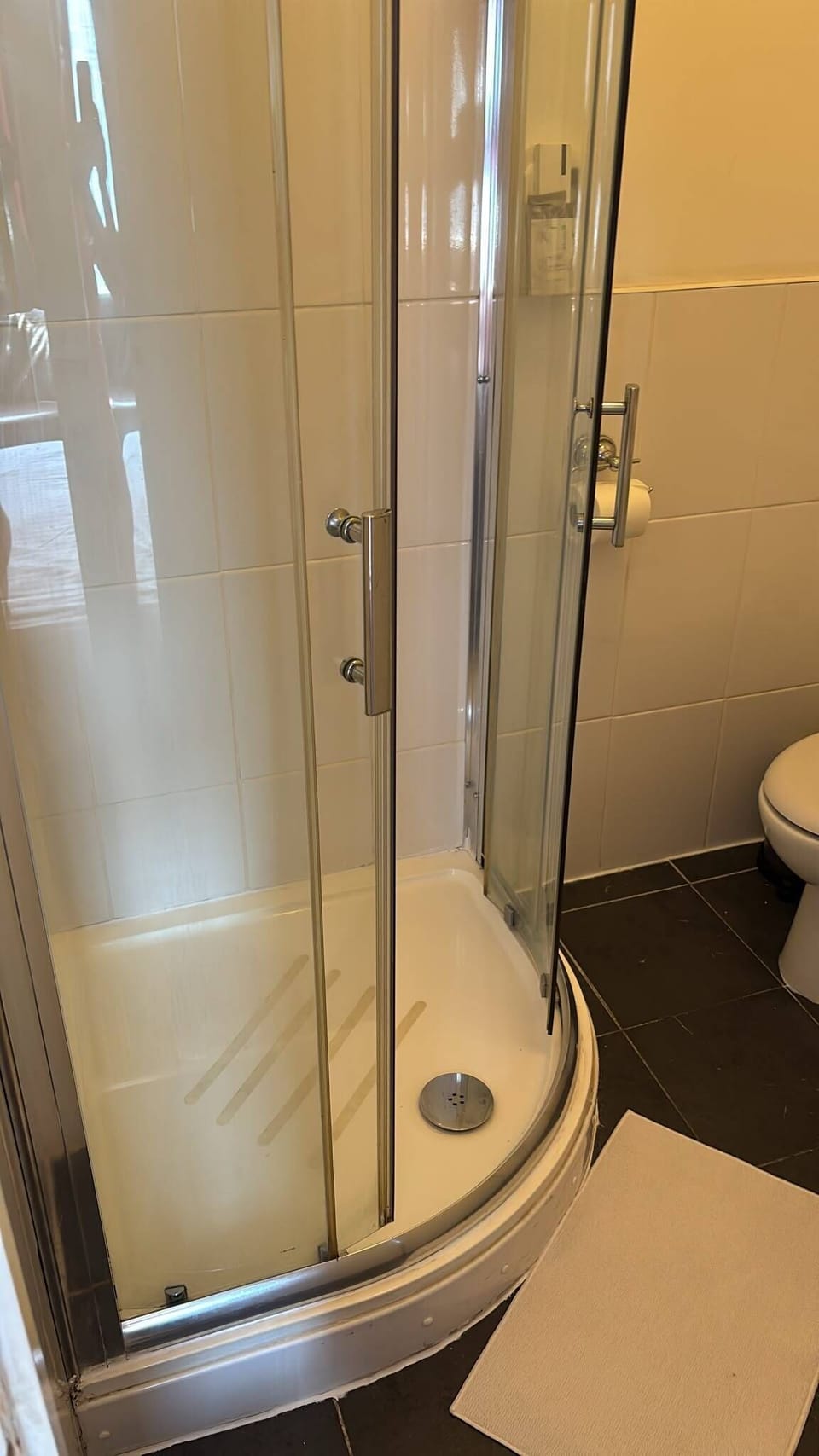 Bright modern bathroom with sleek corner glass shower
